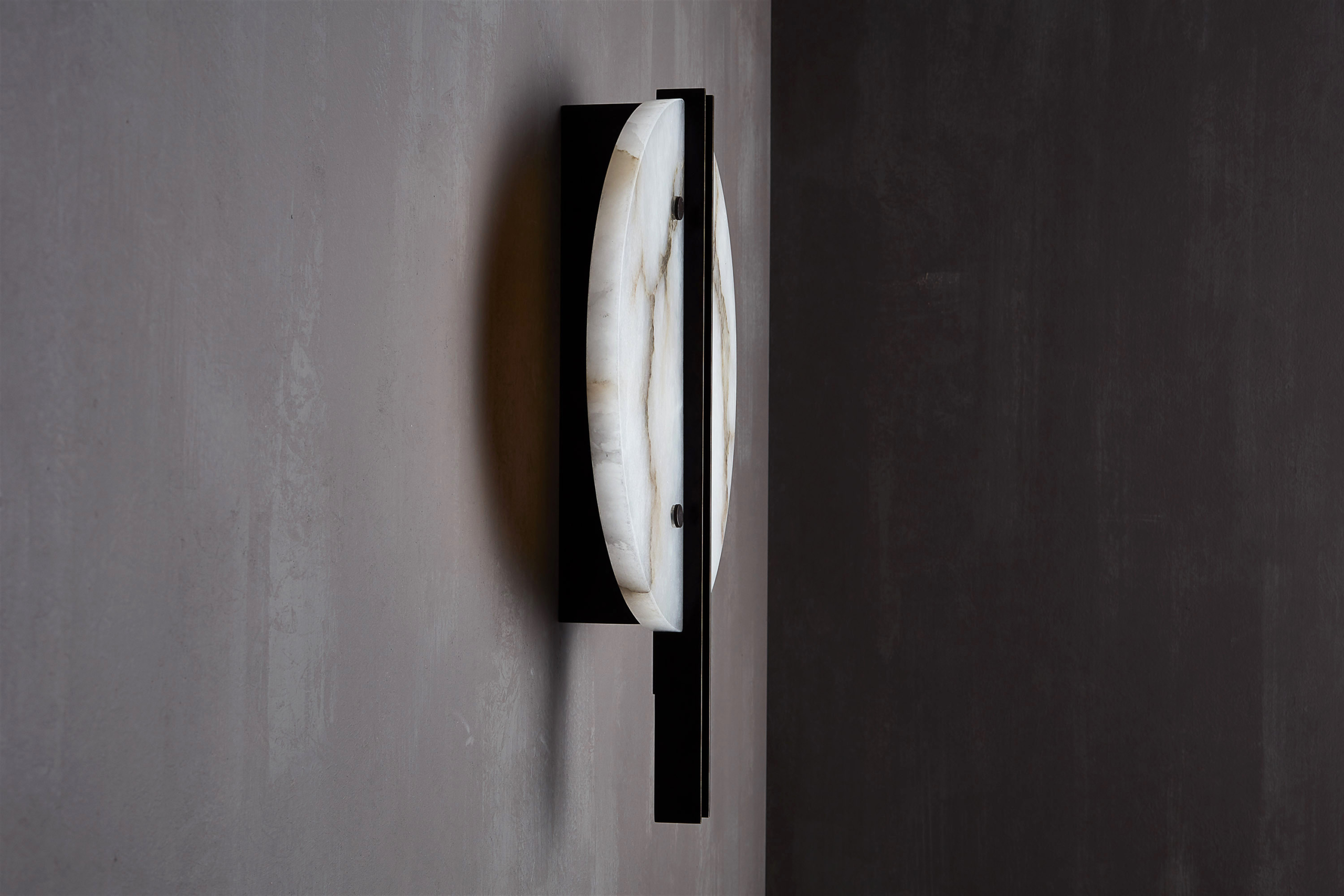 Patinated brass and alabaster wall light designed by Studioloop
