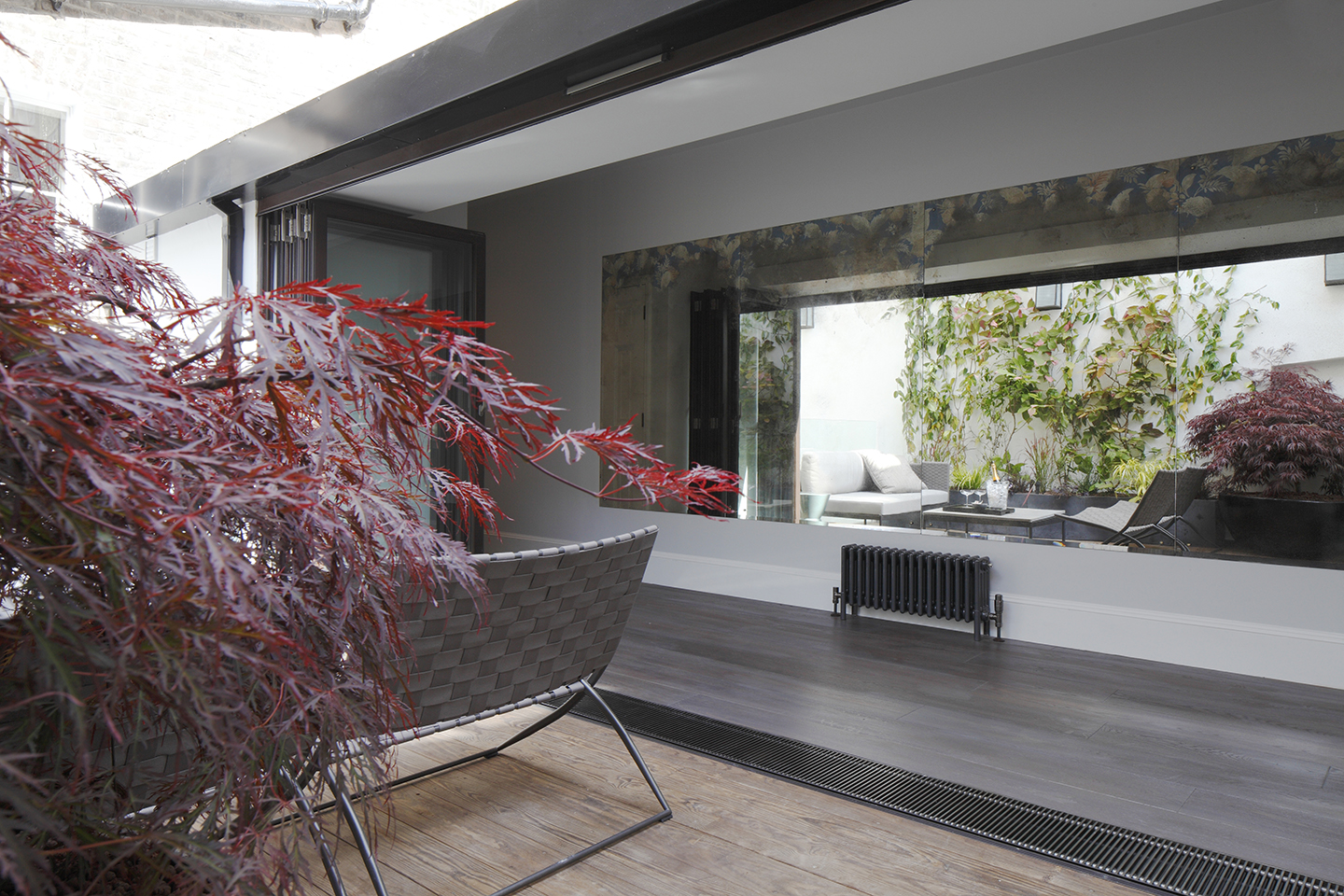 Rear terrace with bifolding door, Bespoke mirror lines the hallway