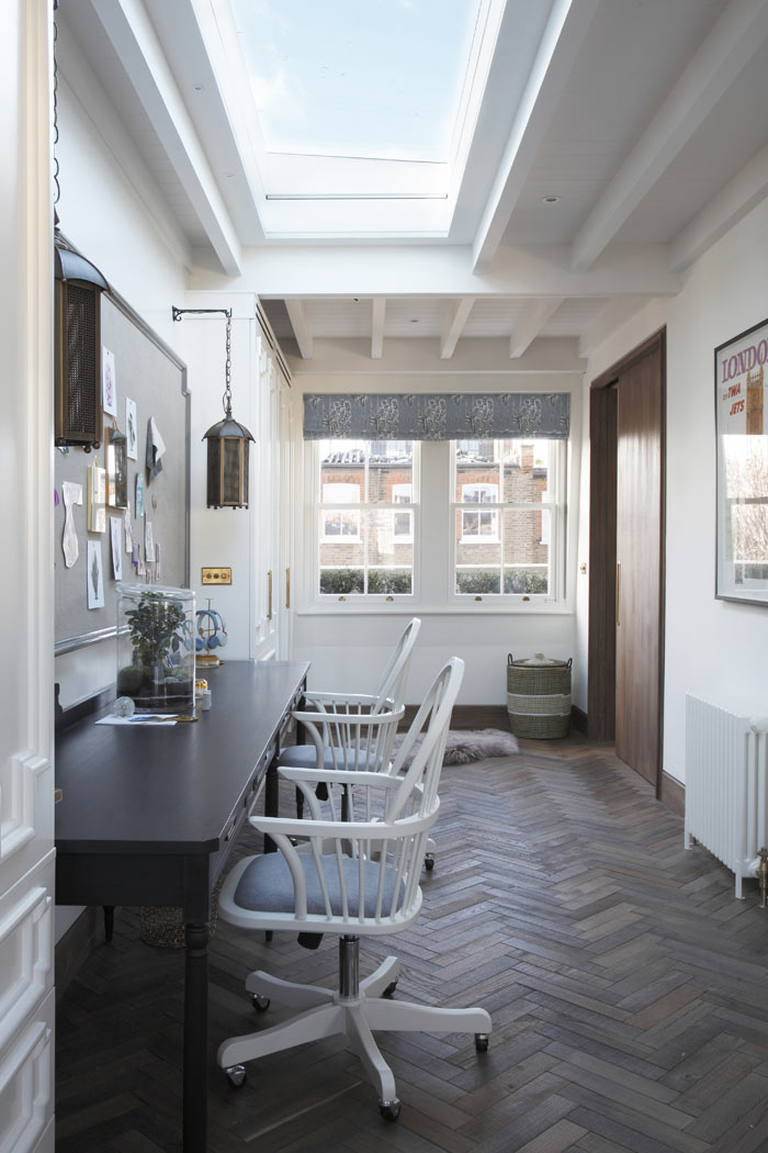 Large skylight above desk area, with exposed beams and timber boarded ceiling. Reclaimed herringbone timber floor. 