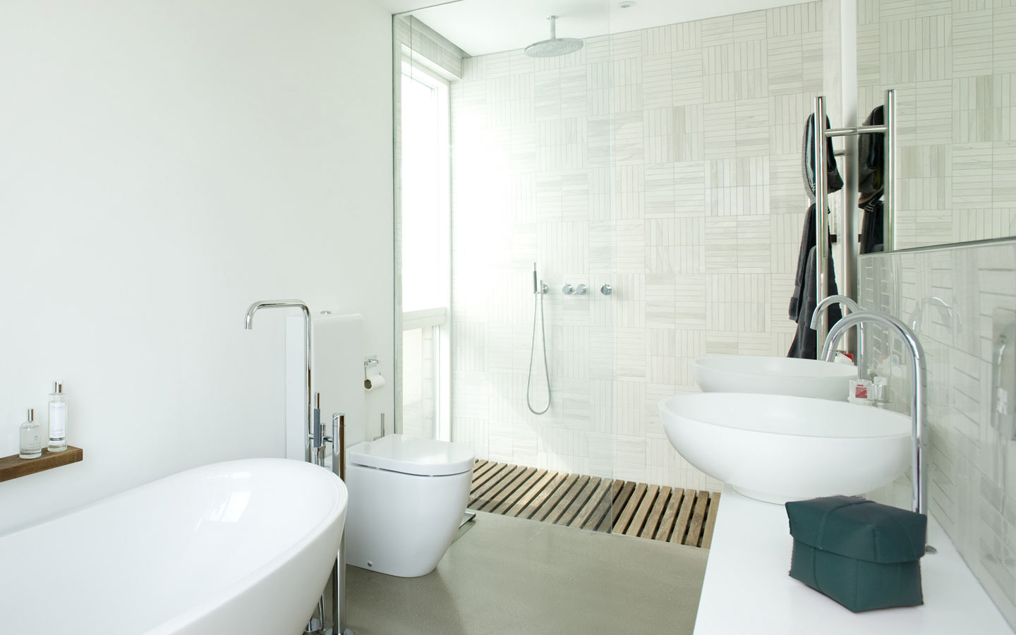 Bright and airy Master bathroom with polished concrete floor.