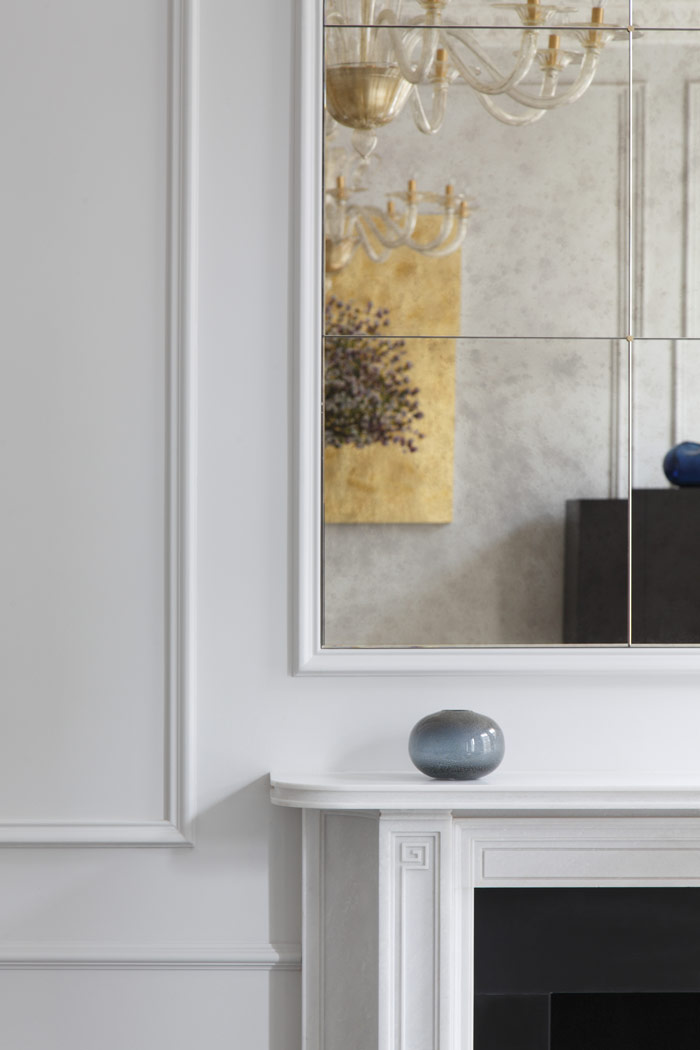 Wall panelling details with Chesney's Soane, white marble fireplace. Murano glass mirror and chandeliers