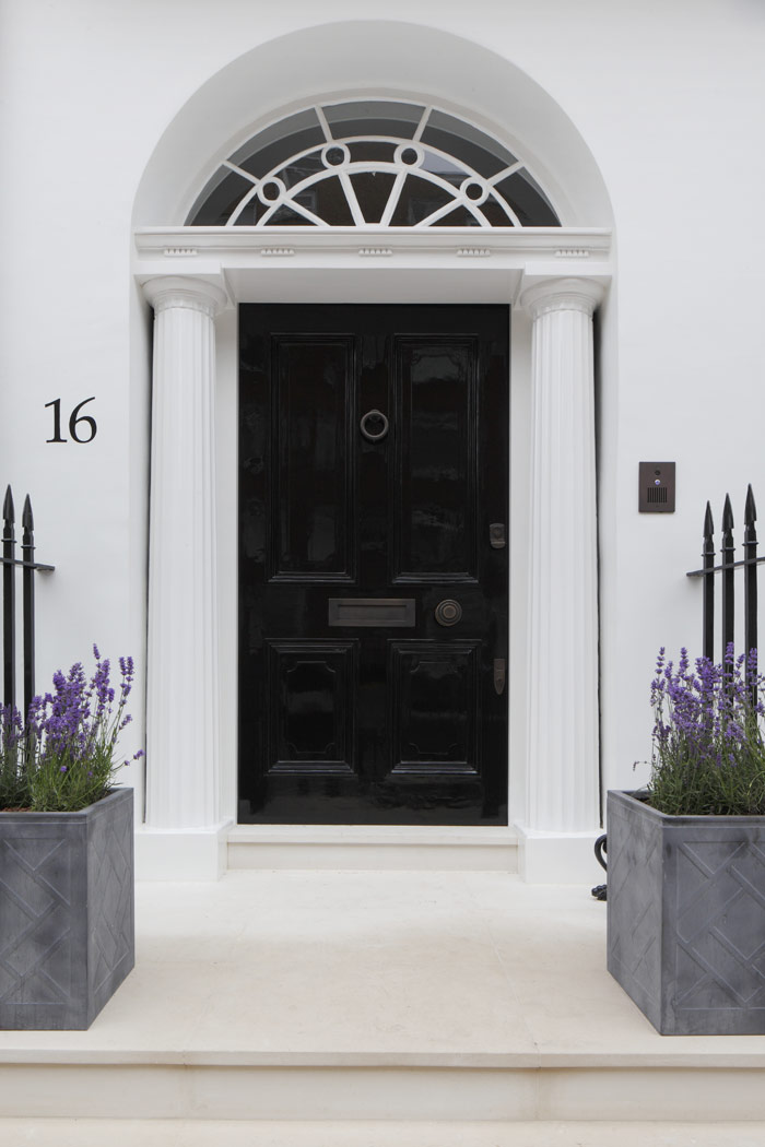 Fully restored Georgian panelled door, with engaged columns and original fanlight. New Portland stone to external steps and refurbished original iron railings