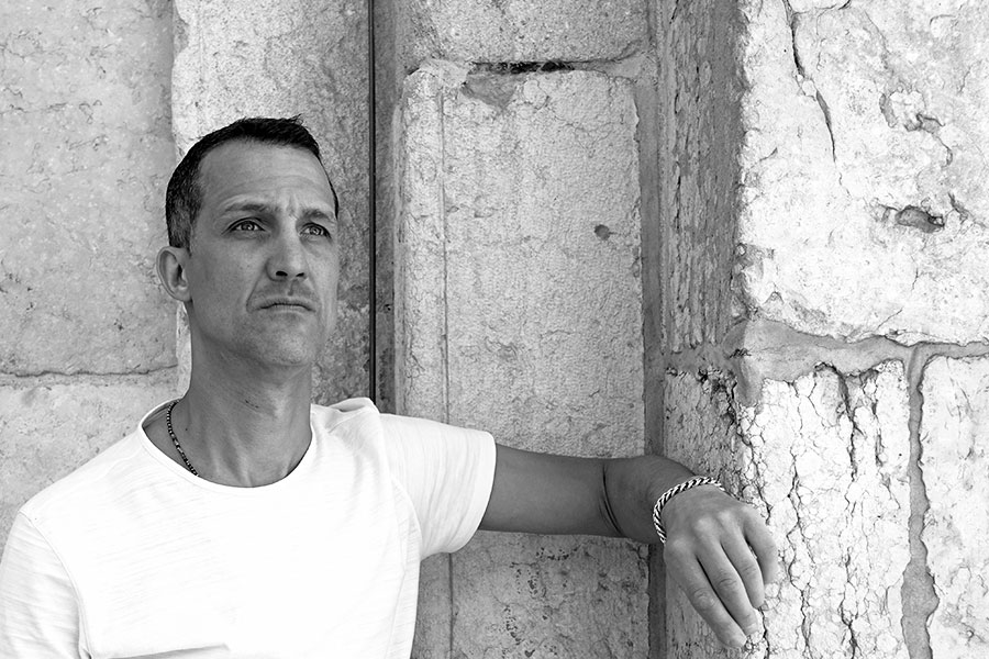 Black and white portrait of Studioloop Director, Gabriel Djilali