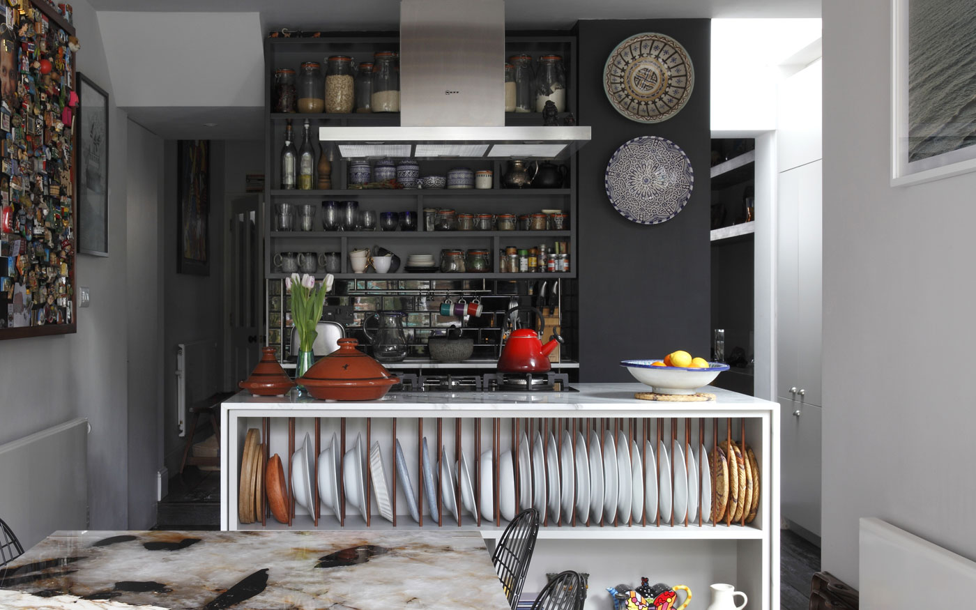 Rear ground floor extension kitchen diner extension, with custom island unit and plate rack. New Brass Carlo Table by Studioloop, with Patagonia Quartzite top.