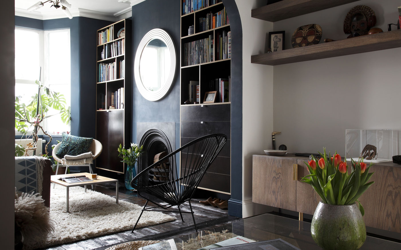 Victorian cottage refurbishment and extension, with bespoke cabinetry and reclaimed 200 year old timber floor. Historic cast iron fireplace and Hague Blue walls.