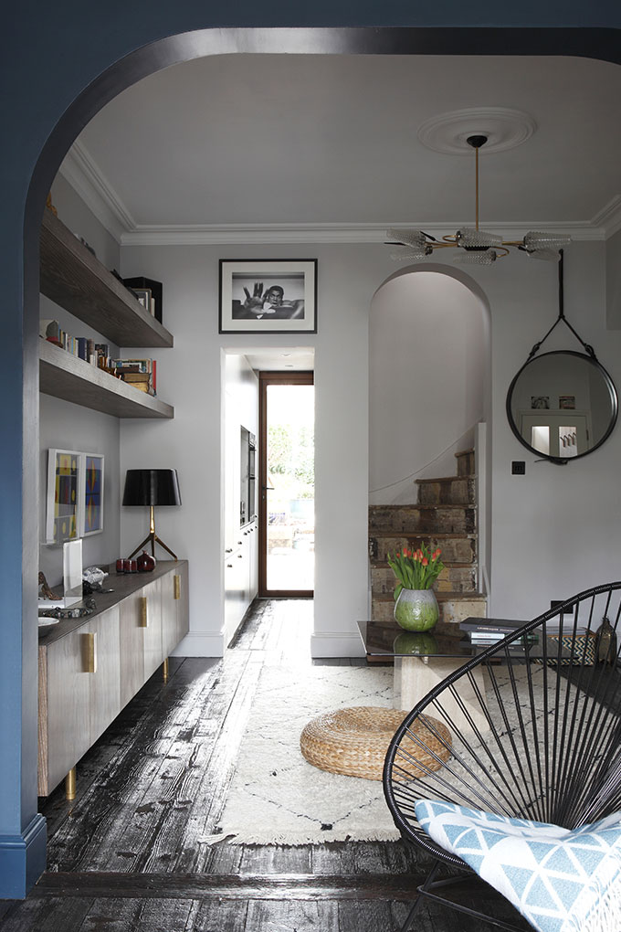 Victorian cottage refurbishment and extension, with bespoke cabinetry and reclaimed 200 year old timber floor. Gubi Adnet mirror, Acapulco chair, antique pendant fitting, Moroccan Berber rug
