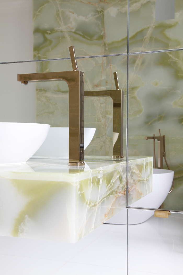 Drawing room with panelled walls and original cornice. Minotti sofa and coffee table, with Bushra Fakhoury sculpture.